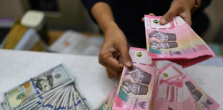 Rupiah Ditutup Menguat terhadap Dolar, Imbas Kenaikan BI-Rate